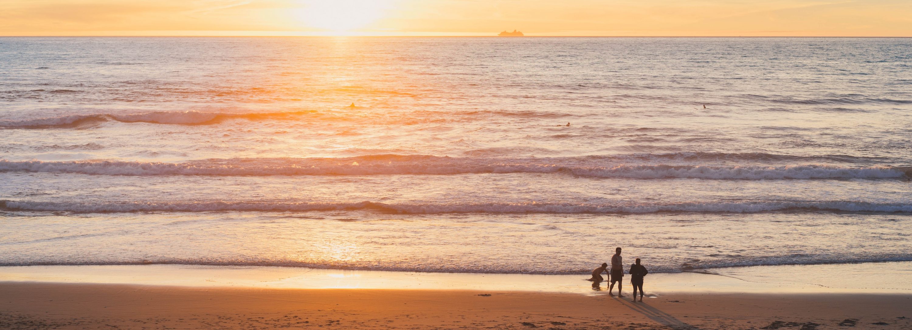 People at a beach in sunset