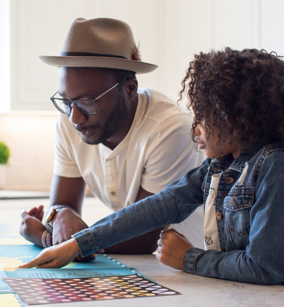 Father helping daughter with work