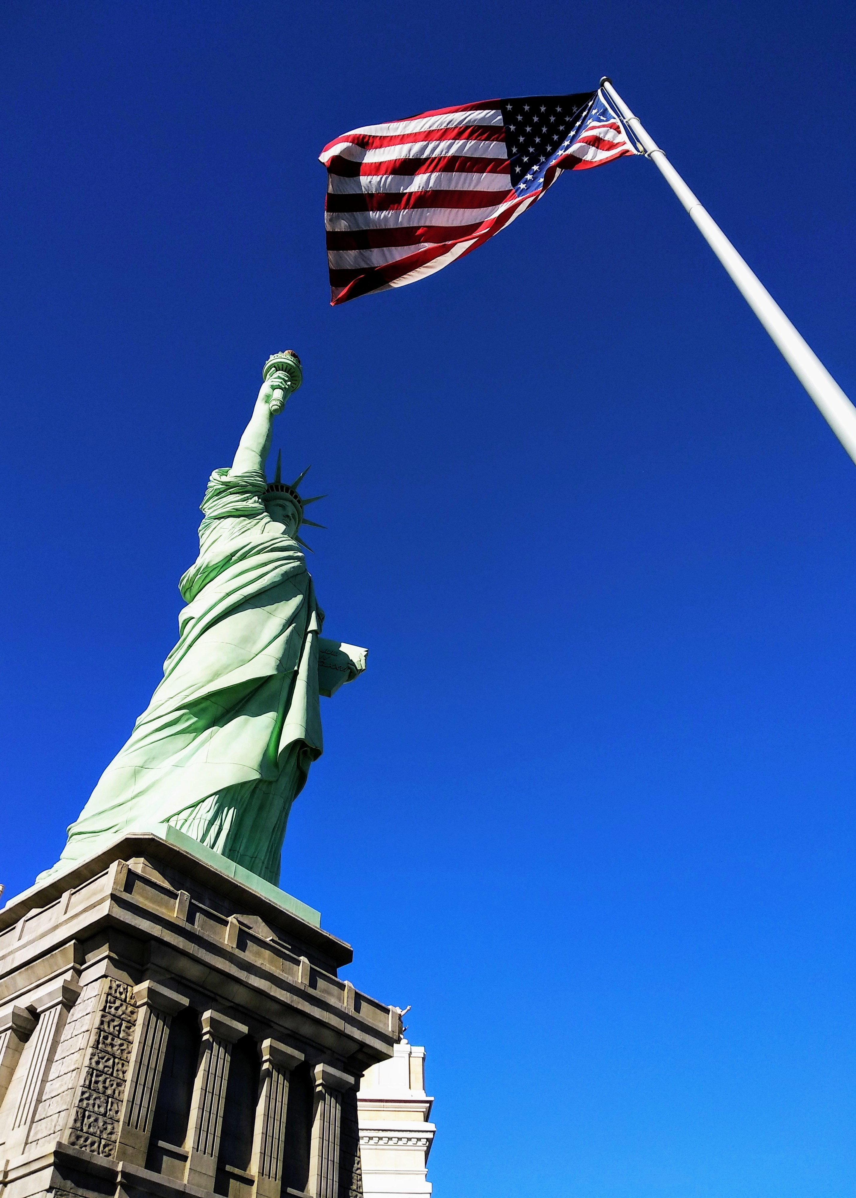 American flag and Statue of Liberty